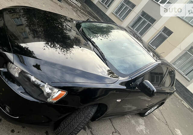 Чорний Міцубісі Lancer, об'ємом двигуна 2 л та пробігом 206 тис. км за 5600 $, фото 9 на Automoto.ua