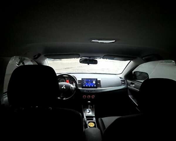 Черный Мицубиси Лансер, объемом двигателя 2 л и пробегом 217 тыс. км за 7000 $, фото 1 на Automoto.ua