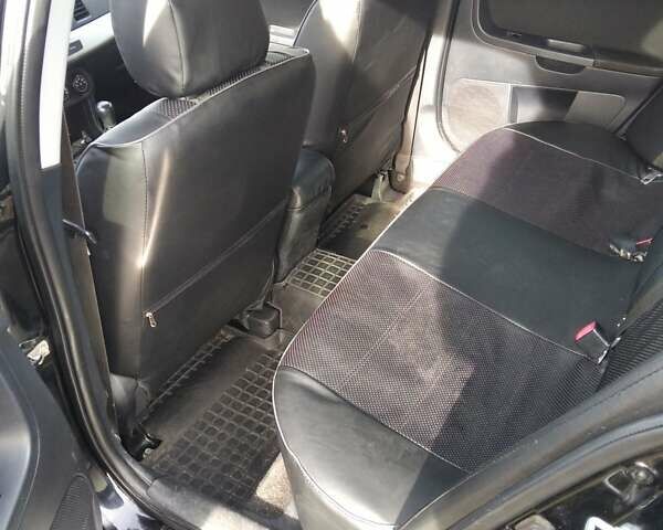 Черный Мицубиси Лансер, объемом двигателя 1.5 л и пробегом 219 тыс. км за 6000 $, фото 3 на Automoto.ua