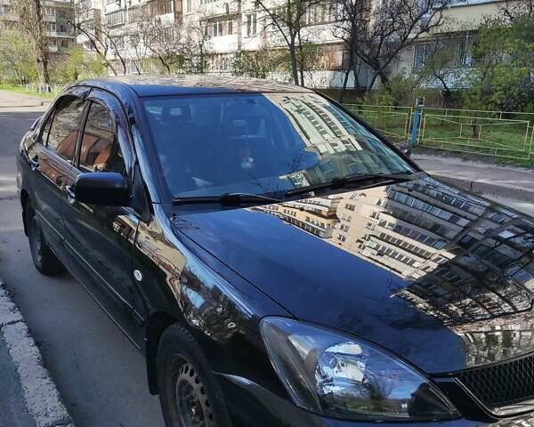 Чорний Міцубісі Lancer, об'ємом двигуна 1.58 л та пробігом 204 тис. км за 4700 $, фото 10 на Automoto.ua