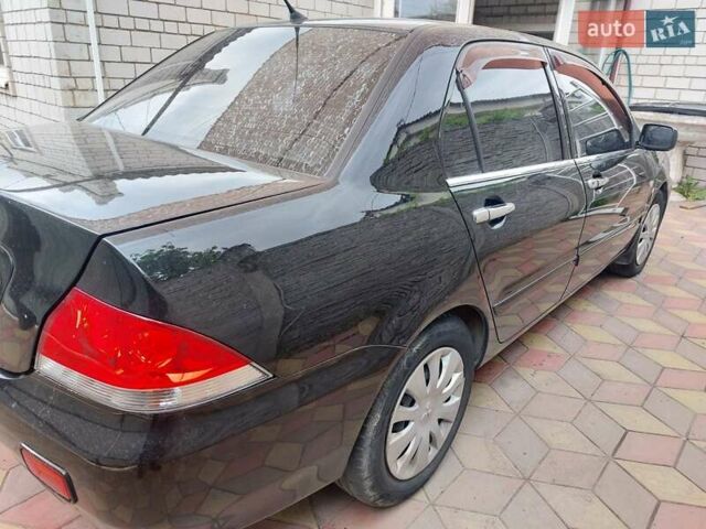 Чорний Міцубісі Lancer, об'ємом двигуна 1.6 л та пробігом 215 тис. км за 4900 $, фото 5 на Automoto.ua