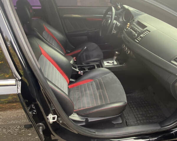 Черный Мицубиси Лансер, объемом двигателя 2 л и пробегом 275 тыс. км за 7700 $, фото 4 на Automoto.ua