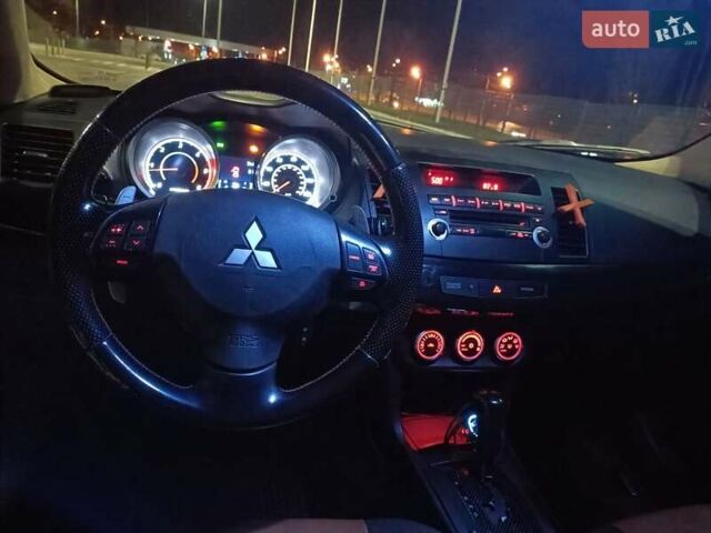 Черный Мицубиси Лансер, объемом двигателя 2 л и пробегом 240 тыс. км за 6400 $, фото 16 на Automoto.ua