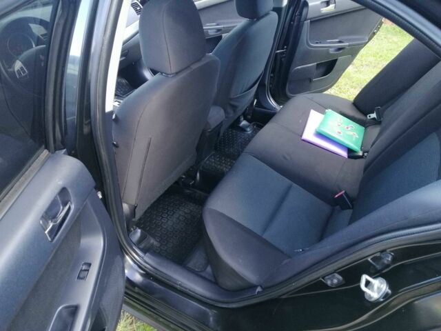 Міцубісі Lancer 2008 у Києві на Automoto.ua Чорний Міцубісі Lancer, об'ємом двигуна 2 л та пробігом 196 тис. км за 5500 $, фото 15 на Automoto.ua