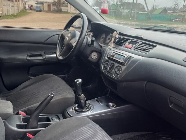 Черный Мицубиси Лансер, объемом двигателя 1.6 л и пробегом 1 тыс. км за 3750 $, фото 4 на Automoto.ua