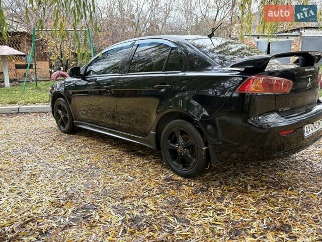 Черный Мицубиси Лансер, объемом двигателя 2 л и пробегом 260 тыс. км за 6100 $, фото 4 на Automoto.ua