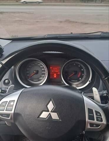 Черный Мицубиси Лансер, объемом двигателя 2 л и пробегом 211 тыс. км за 6900 $, фото 10 на Automoto.ua