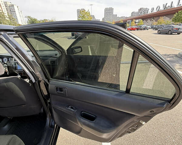 Черный Мицубиси Лансер, объемом двигателя 1.6 л и пробегом 321 тыс. км за 5000 $, фото 34 на Automoto.ua