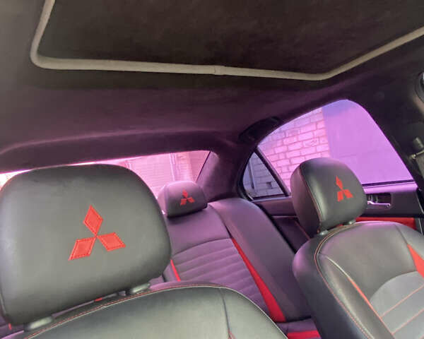 Черный Мицубиси Лансер, объемом двигателя 2 л и пробегом 275 тыс. км за 7700 $, фото 5 на Automoto.ua