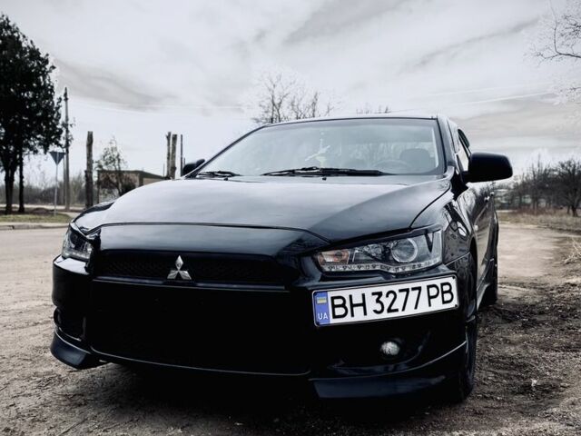 Черный Мицубиси Лансер, объемом двигателя 2 л и пробегом 140 тыс. км за 7200 $, фото 1 на Automoto.ua