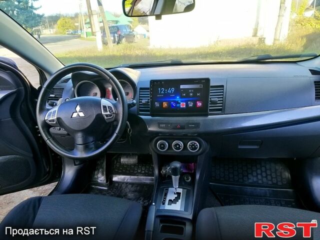 Черный Мицубиси Лансер, объемом двигателя 2 л и пробегом 196 тыс. км за 5500 $, фото 5 на Automoto.ua