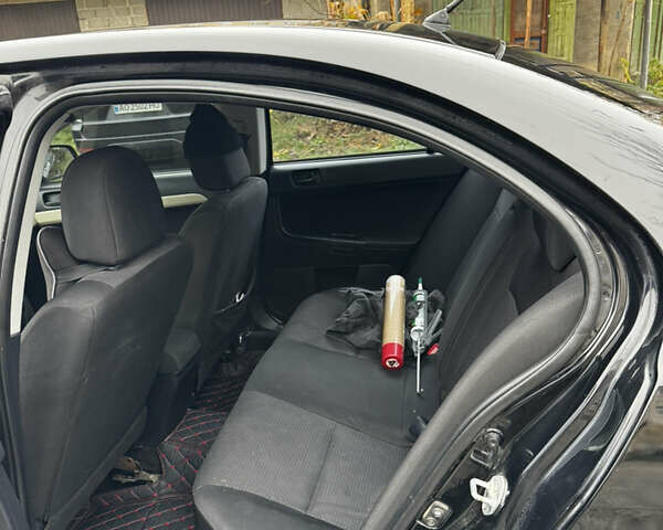 Черный Мицубиси Лансер, объемом двигателя 1.5 л и пробегом 278 тыс. км за 4200 $, фото 10 на Automoto.ua