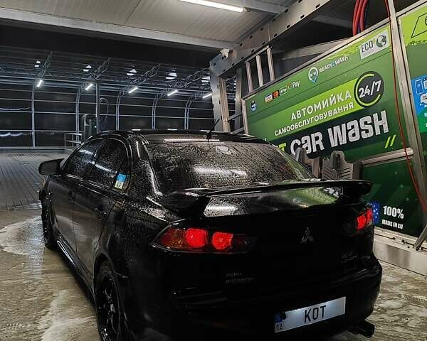 Черный Мицубиси Лансер, объемом двигателя 2 л и пробегом 220 тыс. км за 8300 $, фото 4 на Automoto.ua