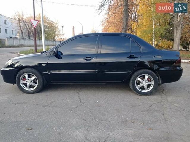 Чорний Міцубісі Lancer, об'ємом двигуна 1.58 л та пробігом 286 тис. км за 4950 $, фото 3 на Automoto.ua