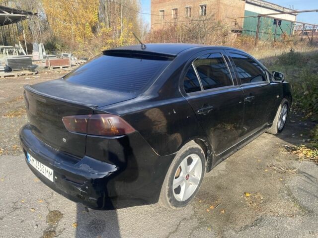 Черный Мицубиси Лансер, объемом двигателя 2 л и пробегом 190 тыс. км за 3100 $, фото 1 на Automoto.ua