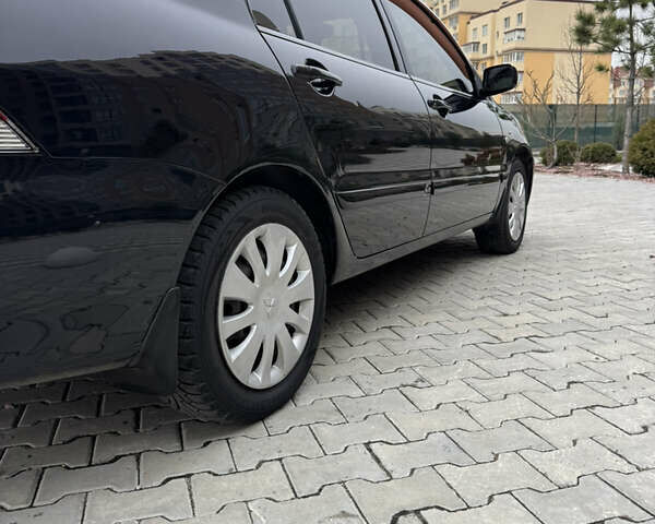 Черный Мицубиси Лансер, объемом двигателя 1.6 л и пробегом 240 тыс. км за 5200 $, фото 9 на Automoto.ua