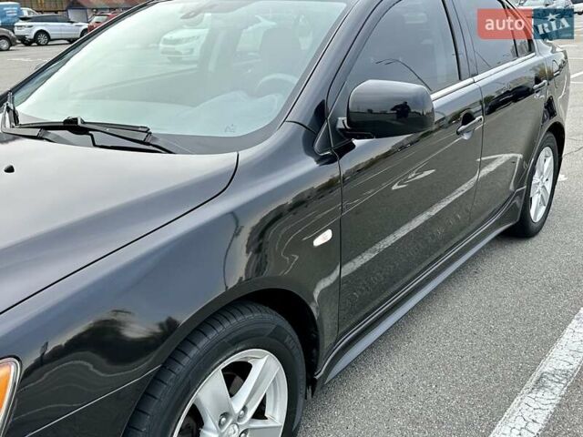 Чорний Міцубісі Lancer, об'ємом двигуна 2 л та пробігом 199 тис. км за 7900 $, фото 3 на Automoto.ua