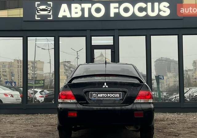 Чорний Міцубісі Lancer, об'ємом двигуна 1.6 л та пробігом 340 тис. км за 6190 $, фото 6 на Automoto.ua
