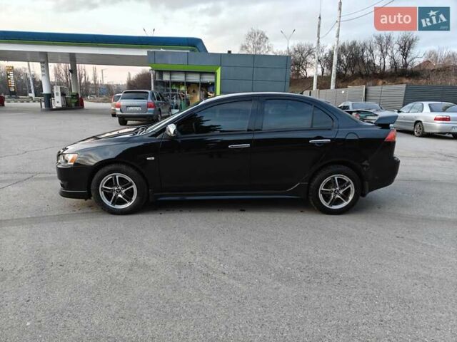 Черный Мицубиси Лансер, объемом двигателя 2 л и пробегом 245 тыс. км за 5600 $, фото 1 на Automoto.ua