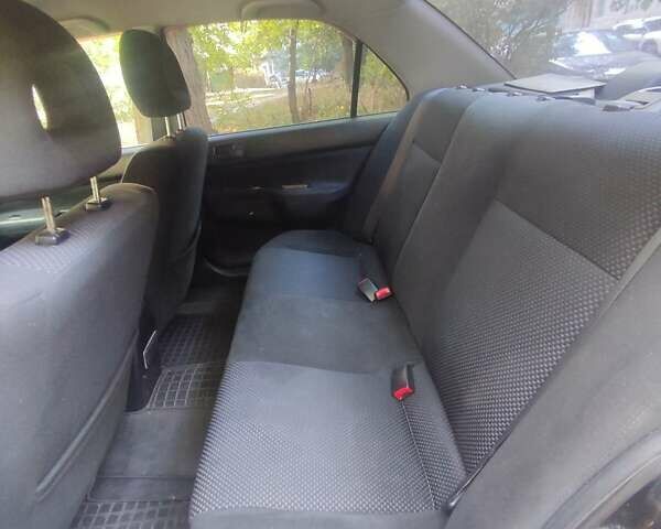 Чорний Міцубісі Lancer, об'ємом двигуна 1.6 л та пробігом 335 тис. км за 3100 $, фото 14 на Automoto.ua