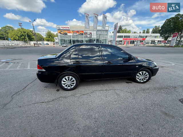 Чорний Міцубісі Lancer, об'ємом двигуна 1.6 л та пробігом 292 тис. км за 3600 $, фото 7 на Automoto.ua