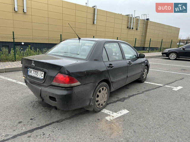 Чорний Міцубісі Lancer, об'ємом двигуна 1.58 л та пробігом 388 тис. км за 2300 $, фото 5 на Automoto.ua