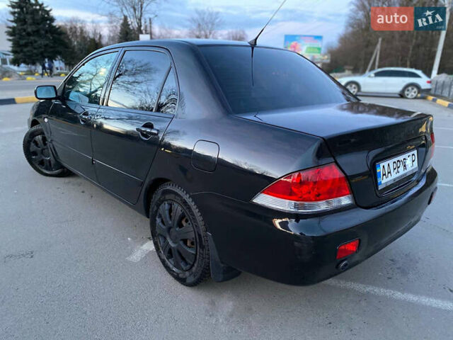 Чорний Міцубісі Lancer, об'ємом двигуна 1.58 л та пробігом 327 тис. км за 4000 $, фото 6 на Automoto.ua