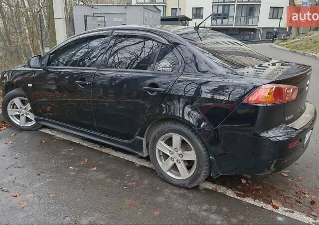 Чорний Міцубісі Lancer, об'ємом двигуна 2 л та пробігом 302 тис. км за 7200 $, фото 2 на Automoto.ua