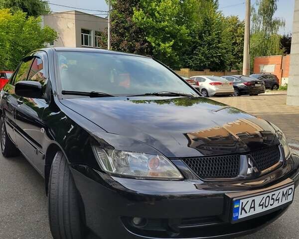Чорний Міцубісі Lancer, об'ємом двигуна 1.58 л та пробігом 334 тис. км за 4750 $, фото 4 на Automoto.ua