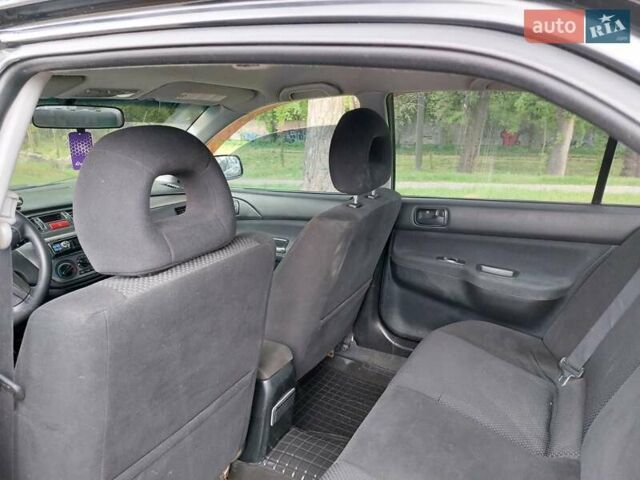 Чорний Міцубісі Lancer, об'ємом двигуна 1.6 л та пробігом 215 тис. км за 4900 $, фото 14 на Automoto.ua