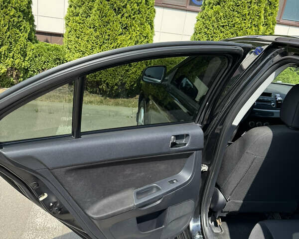 Чорний Міцубісі Lancer, об'ємом двигуна 2 л та пробігом 217 тис. км за 7800 $, фото 28 на Automoto.ua