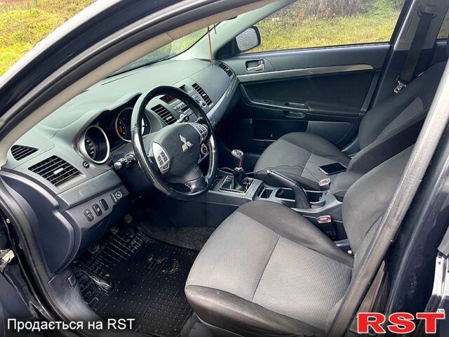 Черный Мицубиси Лансер, объемом двигателя 2 л и пробегом 226 тыс. км за 6600 $, фото 1 на Automoto.ua