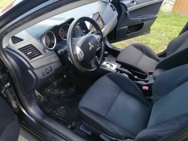 Міцубісі Lancer 2008 у Києві на Automoto.ua Чорний Міцубісі Lancer, об'ємом двигуна 2 л та пробігом 196 тис. км за 5500 $, фото 13 на Automoto.ua