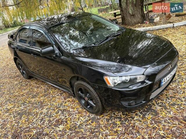 Черный Мицубиси Лансер, объемом двигателя 2 л и пробегом 260 тыс. км за 6100 $, фото 1 на Automoto.ua