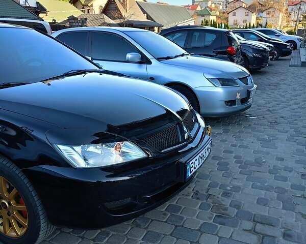 Мицубиси Лансер 2008 в Львове на Automoto.ua Черный Мицубиси Лансер, объемом двигателя 1.58 л и пробегом 200 тыс. км за 5200 $, фото 115 на Automoto.ua