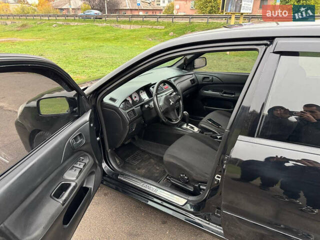 Чорний Міцубісі Lancer, об'ємом двигуна 1.6 л та пробігом 200 тис. км за 4500 $, фото 1 на Automoto.ua