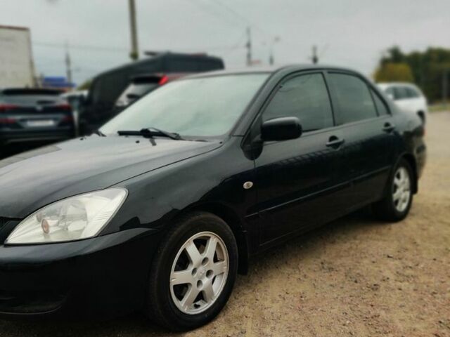 Чорний Міцубісі Lancer, об'ємом двигуна 1.6 л та пробігом 257 тис. км за 4200 $, фото 2 на Automoto.ua