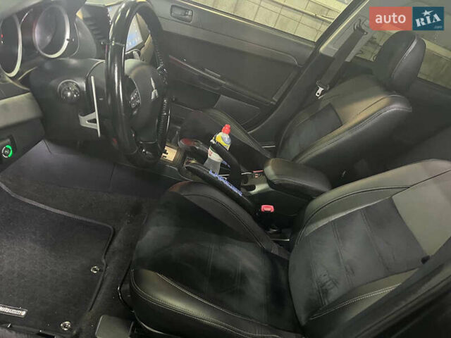 Черный Мицубиси Лансер, объемом двигателя 2 л и пробегом 200 тыс. км за 8000 $, фото 5 на Automoto.ua