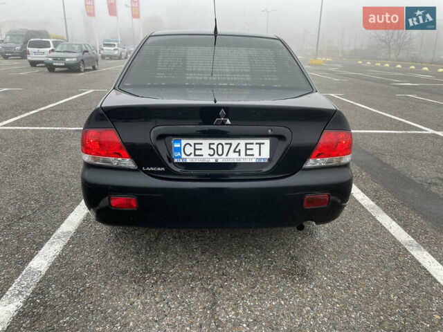 Черный Мицубиси Лансер, объемом двигателя 1.58 л и пробегом 214 тыс. км за 4400 $, фото 10 на Automoto.ua