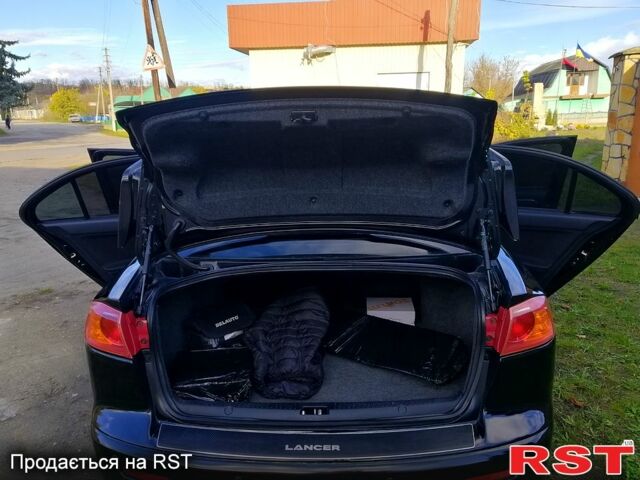 Черный Мицубиси Лансер, объемом двигателя 2 л и пробегом 196 тыс. км за 5500 $, фото 7 на Automoto.ua