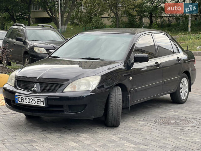 Черный Мицубиси Лансер, объемом двигателя 1.6 л и пробегом 167 тыс. км за 4850 $, фото 7 на Automoto.ua