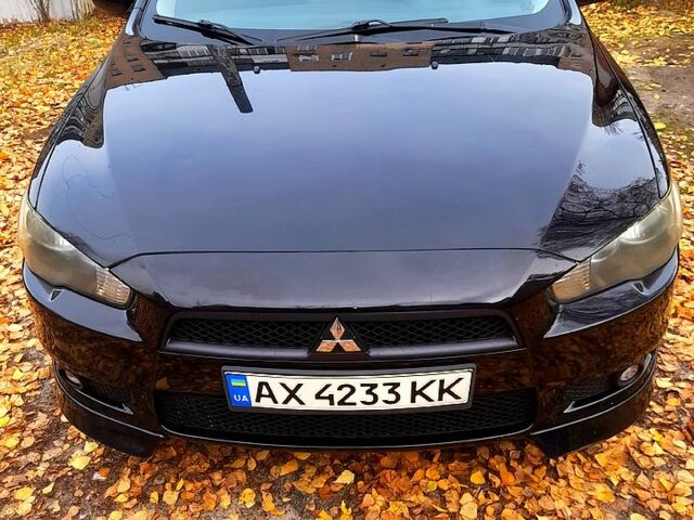 Черный Мицубиси Лансер, объемом двигателя 2 л и пробегом 260 тыс. км за 7000 $, фото 1 на Automoto.ua