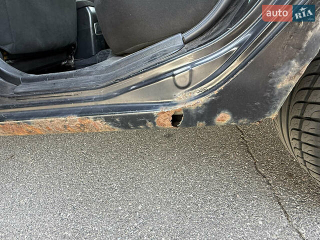 Черный Мицубиси Лансер, объемом двигателя 1.6 л и пробегом 321 тыс. км за 5000 $, фото 38 на Automoto.ua