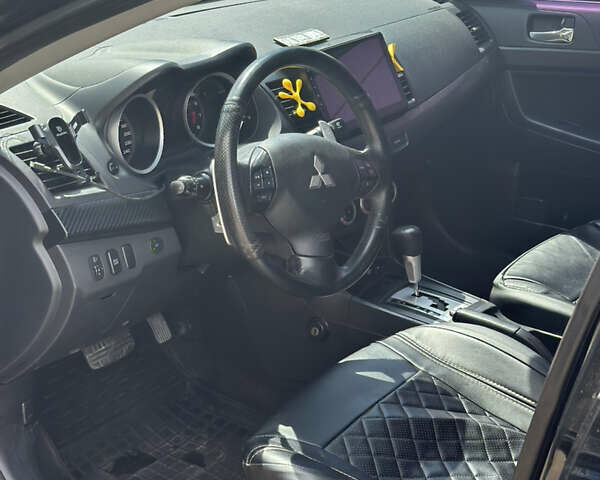 Черный Мицубиси Лансер, объемом двигателя 2 л и пробегом 295 тыс. км за 7000 $, фото 6 на Automoto.ua