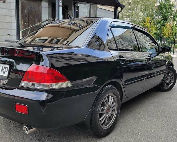 Чорний Міцубісі Lancer, об'ємом двигуна 1.58 л та пробігом 334 тис. км за 4750 $, фото 9 на Automoto.ua