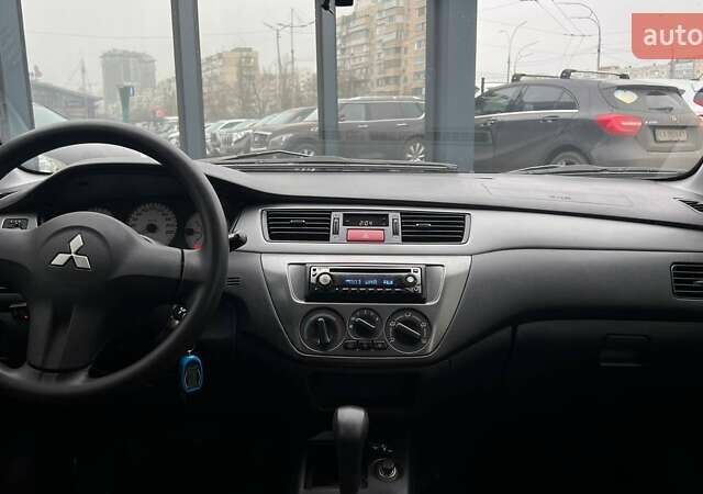 Чорний Міцубісі Lancer, об'ємом двигуна 1.6 л та пробігом 340 тис. км за 6190 $, фото 12 на Automoto.ua