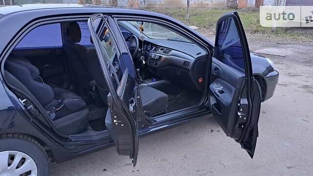 Чорний Міцубісі Lancer, об'ємом двигуна 1.6 л та пробігом 131 тис. км за 6000 $, фото 9 на Automoto.ua