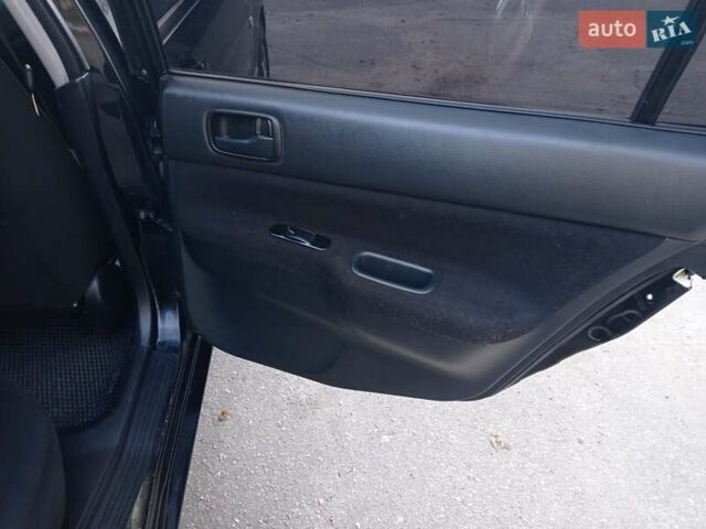 Чорний Міцубісі Lancer, об'ємом двигуна 1.58 л та пробігом 286 тис. км за 4950 $, фото 15 на Automoto.ua