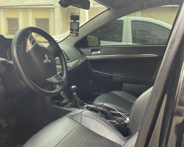 Чорний Міцубісі Lancer, об'ємом двигуна 2 л та пробігом 255 тис. км за 6999 $, фото 11 на Automoto.ua