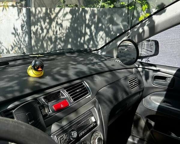 Чорний Міцубісі Lancer, об'ємом двигуна 1.6 л та пробігом 294 тис. км за 6500 $, фото 17 на Automoto.ua